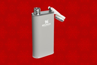 a stanley flask on a christmas background