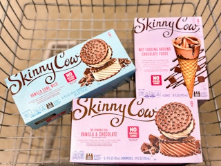 light blue and pink boxes of Skinny Cow ice cream sandwiches and cones in a cart