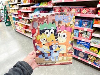 hand holding holiday advent calendars at walgreens