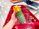 hand holding cat & jack water bottle over target cart