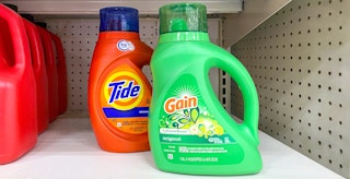gain vs tide - bottles of tide and gain laundry detergent on store shelf