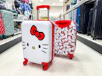 hello kitty spinner suitcase sitting in a target aisle