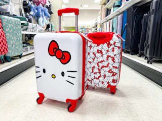 hello kitty spinner suitcase sitting in a target aisle
