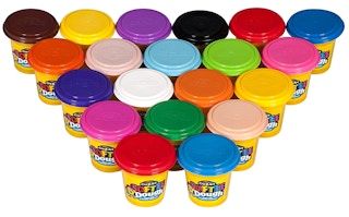 Colorful modeling dough lined on a white background