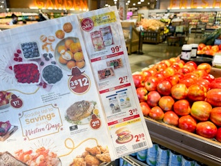 Albertsons ad held in the produce section