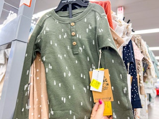 hand holding tag of baby clearance clothing clearance at walmart