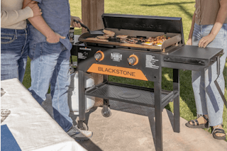 family using an outdoor griddle
