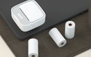 a sticker printer and rolls of paper 