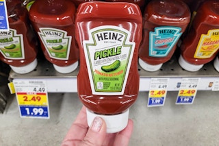 hand holding a bottle of heinz pickle ketchup at kroger