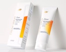 a tube of body cream next to its packaging 