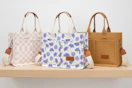 3 canvas tote bags sitting on a shelf