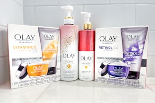 olay products on a shelf in someone's bathroom