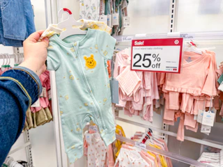 hand holding cloud island baby apparel at target