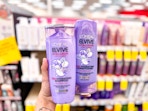 hand holding loreal elvive hair care