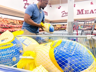 Person shopping with butterball turkeys in the forground