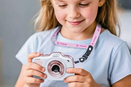 Lifestyle image of child holding the NBD digital camera