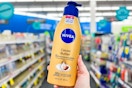 person holding a bottle of nivea lotion in an aisle
