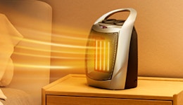 a small heater on a nightstand
