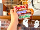hand holding full size candy bars