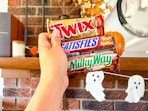hand holding full size candy bars