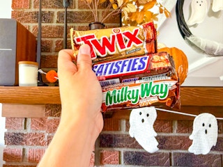 hand holding full size candy bars