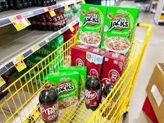 4 boxes of apple jacks, 3 dr pepper 12-packs, and 3 dr pepper 2-liters in a cart