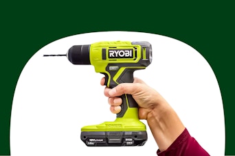 Stock image of person holding the Ryobi droll (close up shot)