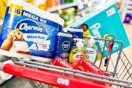 charmin toilet paper, nivea body wash, softsoap hand soap, colgate toothpaste, and pampers diapers in a cart
