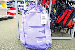 purple nike backpack hanging on a display