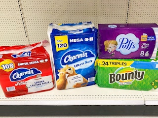 Puffs, Charmin, Charmin, Bounty, stacked together on store shelf