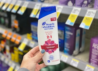 hand holding bottle of head & shoulders