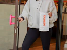 a person exiting dunkin donuts