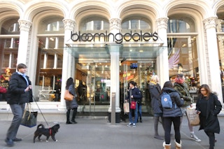 groups of people outside a bloomingdales store front