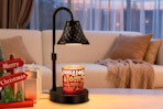 Banbanda Adjustable Candle Warmer Lamp with Timer on an accent table.