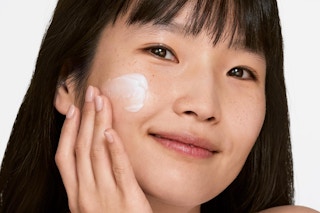 a woman using a clinique hydrator