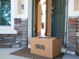 Asos Box in front of an open door