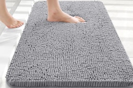 a woman stepping on a bathroom rug
