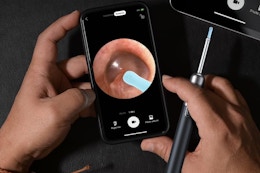an ear wax removal tool showing the inside of an ear on a phone