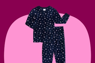 black with white polk dots pajamas on a pink and maroon background