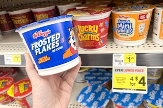 hand holding kelloggs frosted flakes cereal cup at dollar general