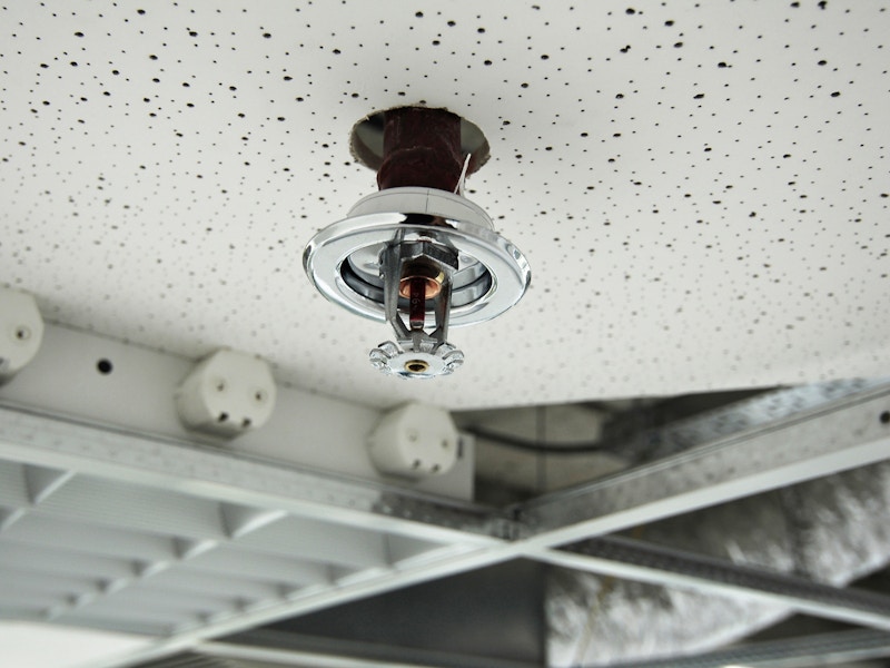 a fire sprinkler on a ceiling