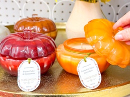 threshold pumpkin candles sitting next to each other
