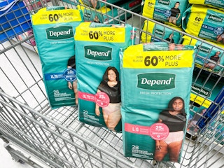 three packages of Depend underwear in a Walmart cart