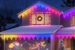 AHAWILL Icicle Lights for Outside on a house lit-up at night.