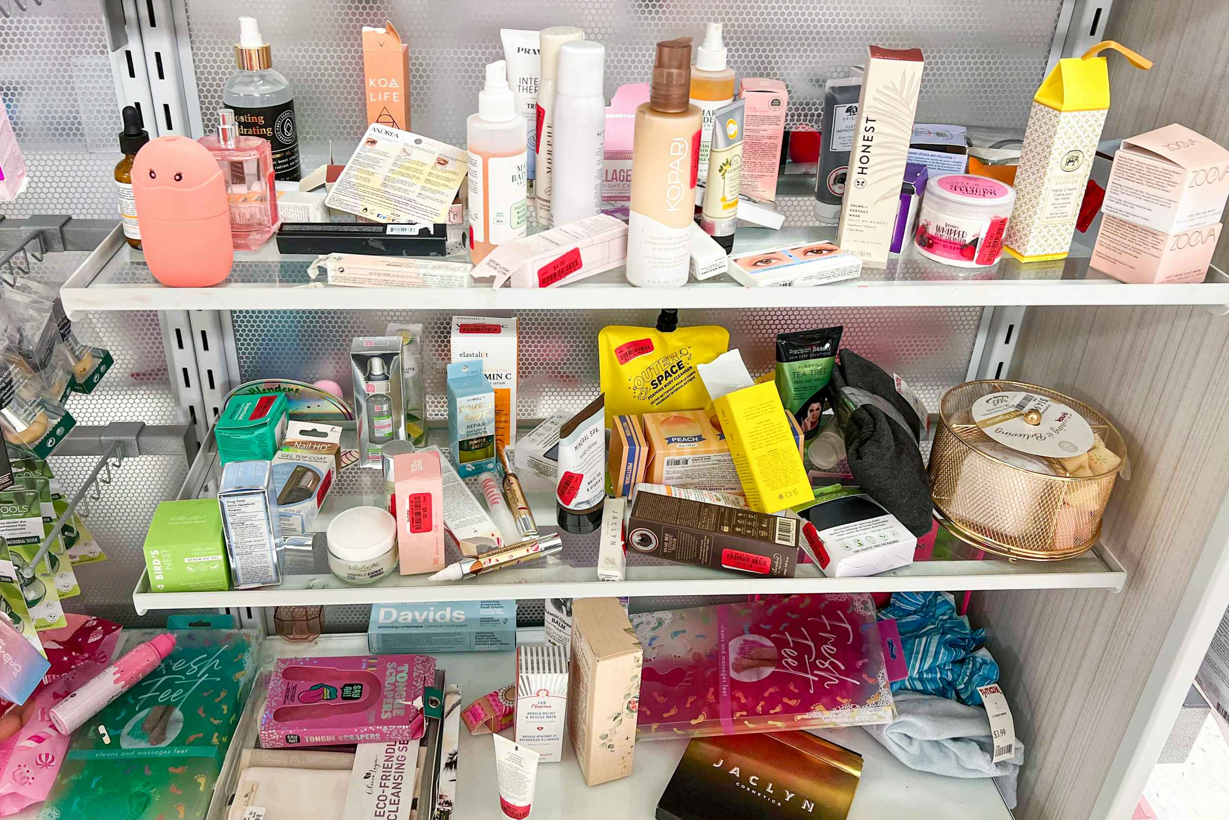 disorganized cosmetic shelves at tjmaxx