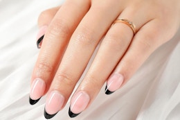 a woman wearing press-on nails
