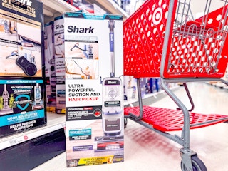 Shark Rotator Pet Lift-Away Vacuum sitting in front of a target shelf