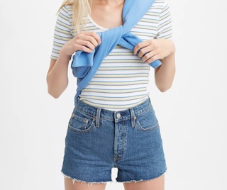 A woman wearing Levi's 501 original shorts.