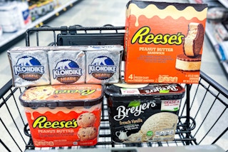 reese's, klondike and breyers ice cream in a shopping cart