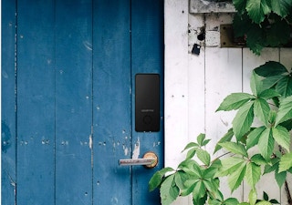 lifestyle image of Igloohome bluetooth deadbolt on door